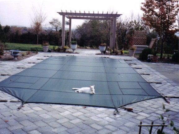 Outdoor patio with a covered swimming pool