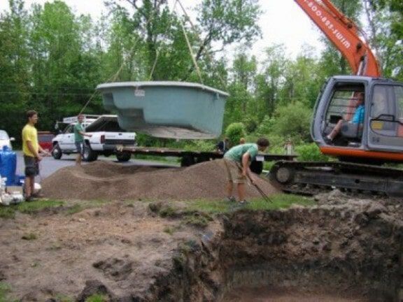 Construction workers building a pool