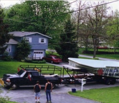 Tow truck hauling a heavy equipment