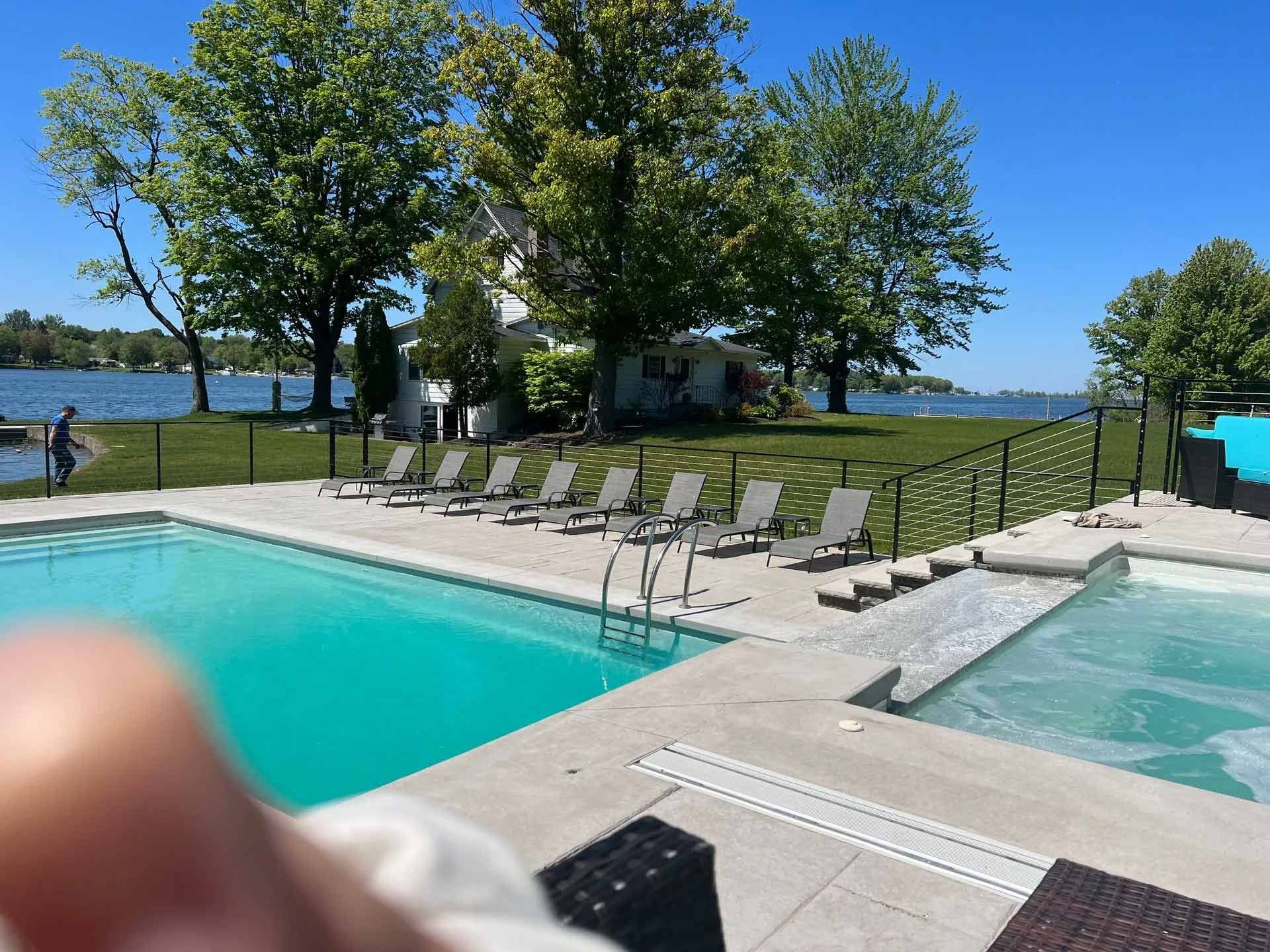 Poolside patio with lounge chairs