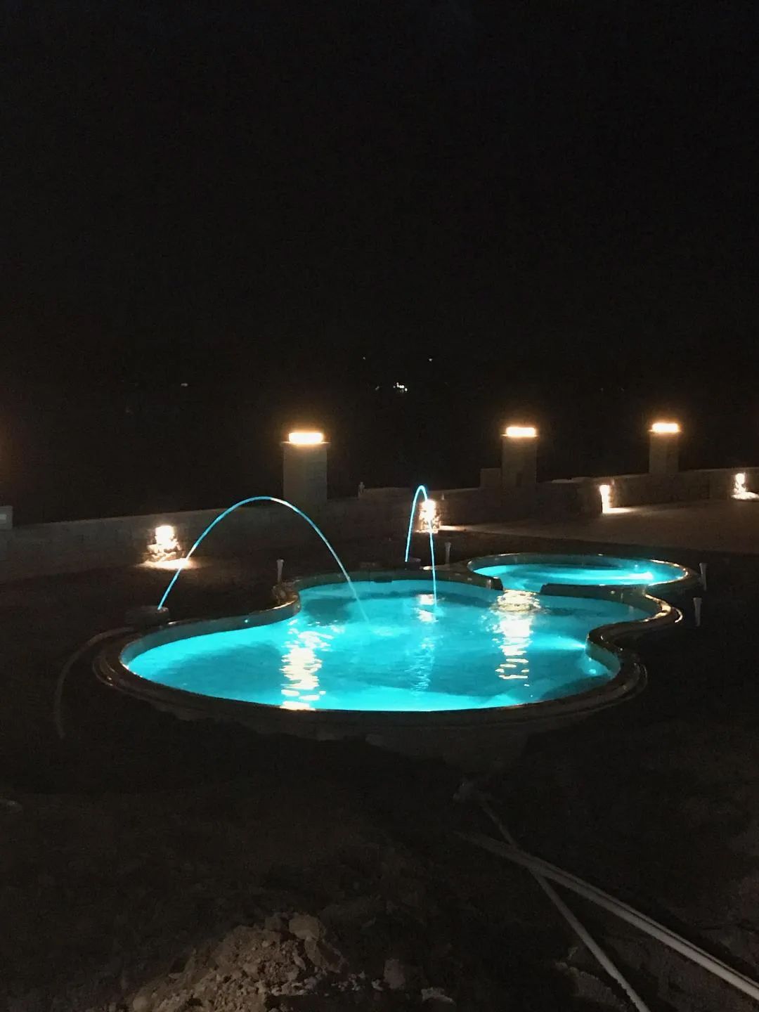 Lit swimming pool at night