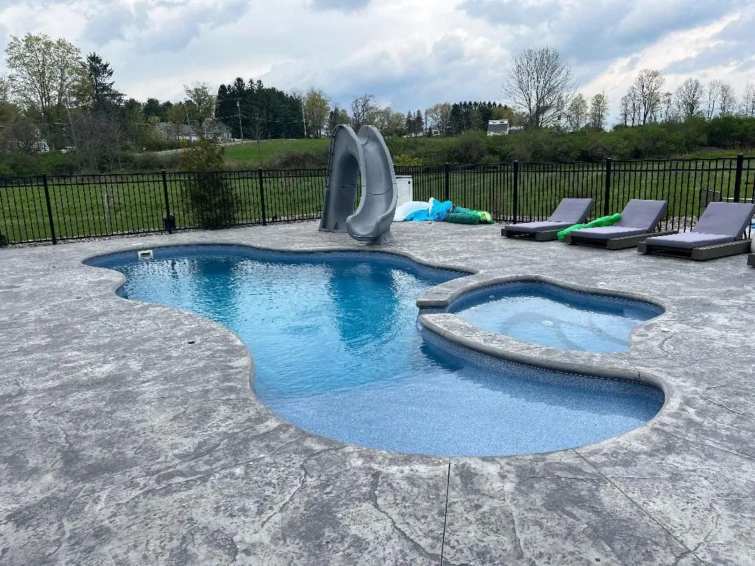 Backyard pool with a slide