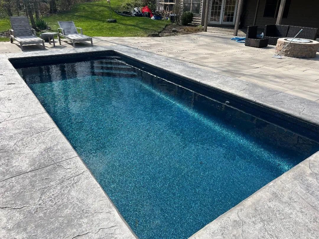 Clear water of a backyard swimming pool
