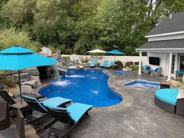 Backyard pool with umbrellas