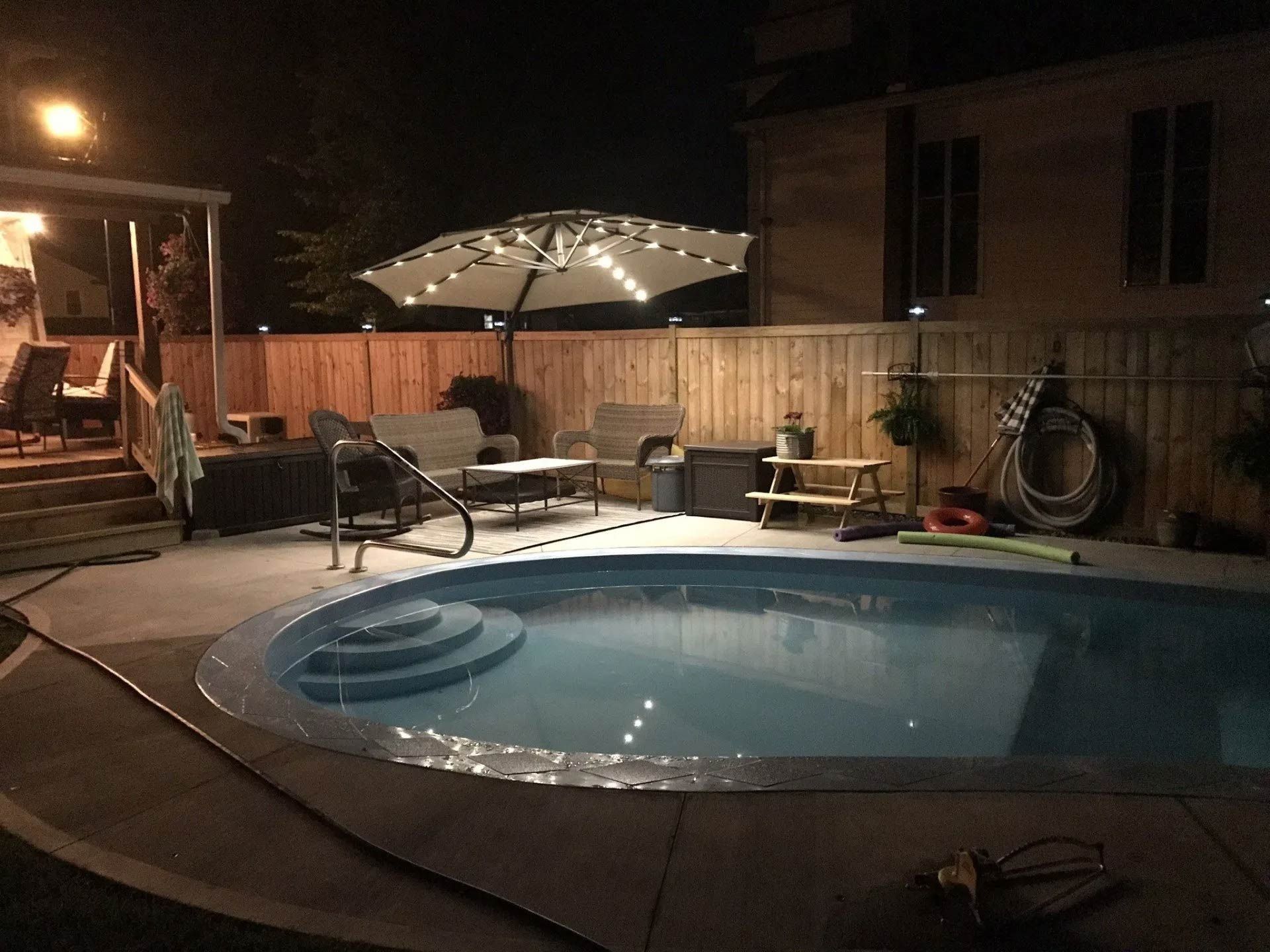 Backyard pool at night