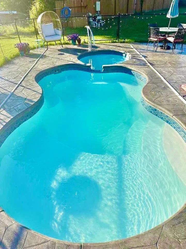 Backyard pool under a bright sunny day