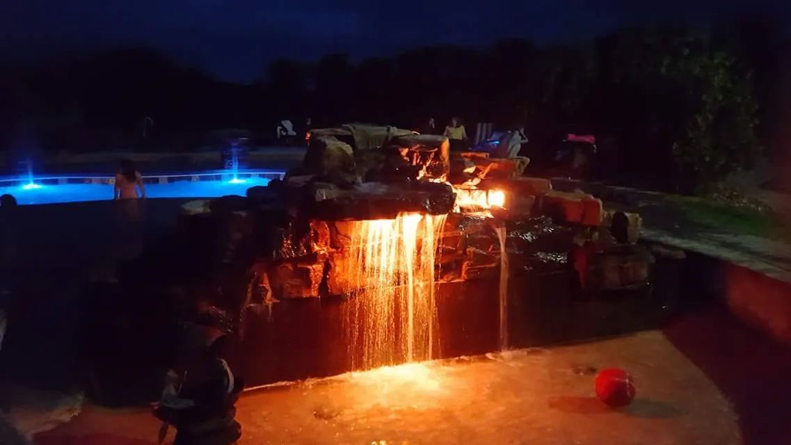 Night lights in backyard swimming pool