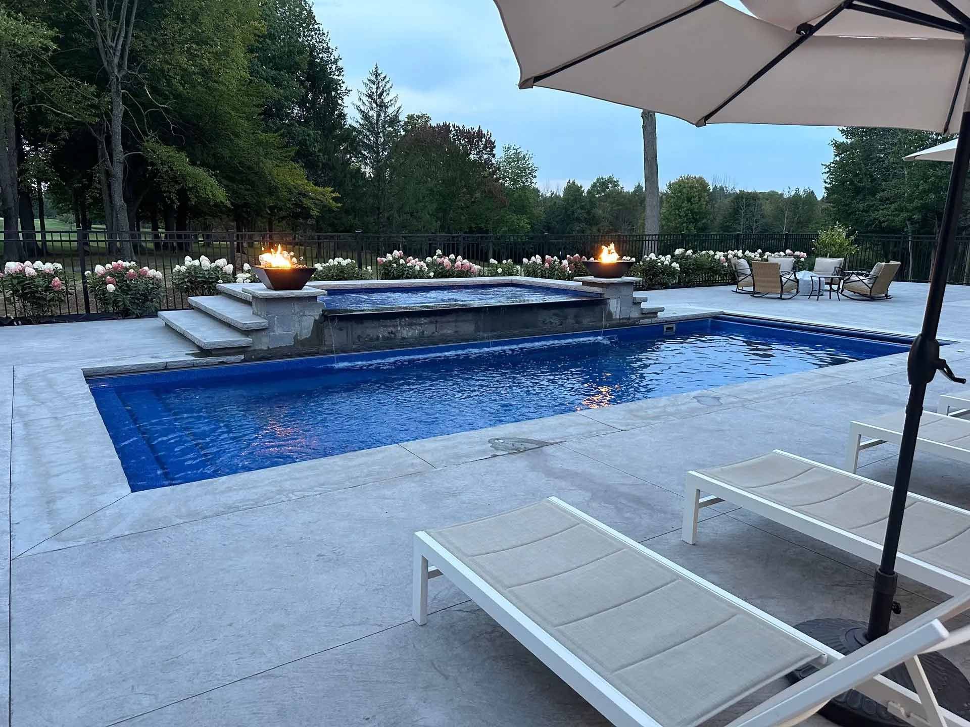 Modern outdoor pool with lounge chairs