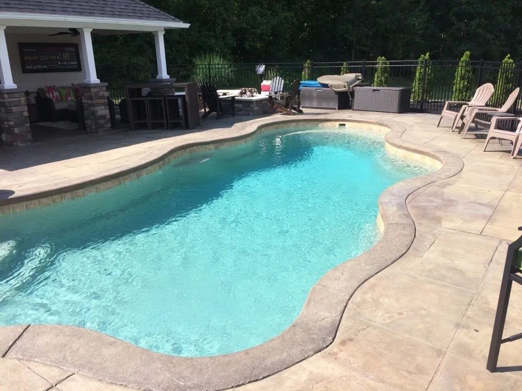 Turquoise water of a pool in backyard