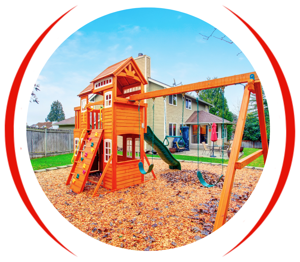 a wooden playground with a slide and swings in front of a house .