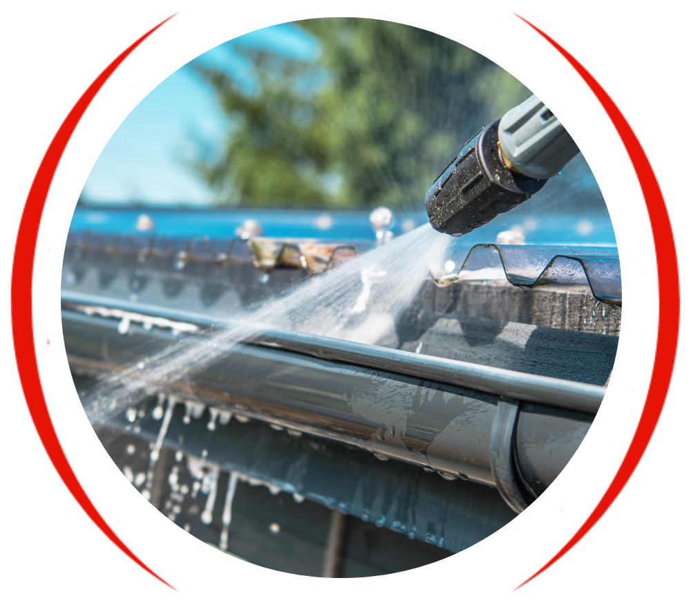 a person is cleaning a gutter with a high pressure washer .