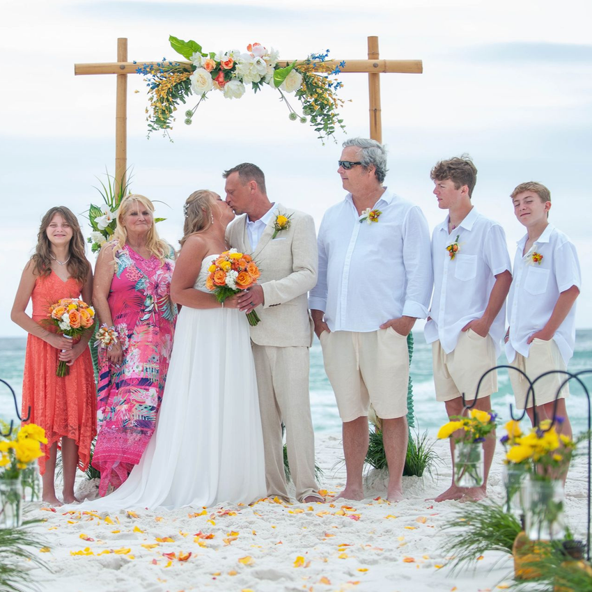 bride and groom kissing during Florida beach wedding