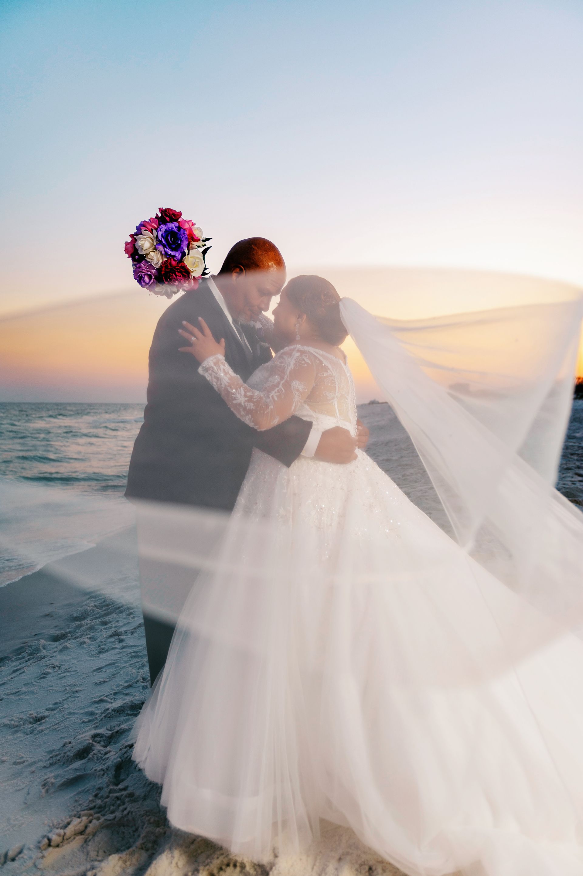 bride and groom on beach