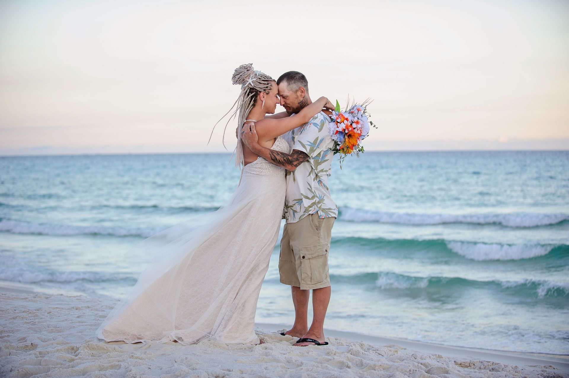 bride and groom embracing during 30A beach wedding