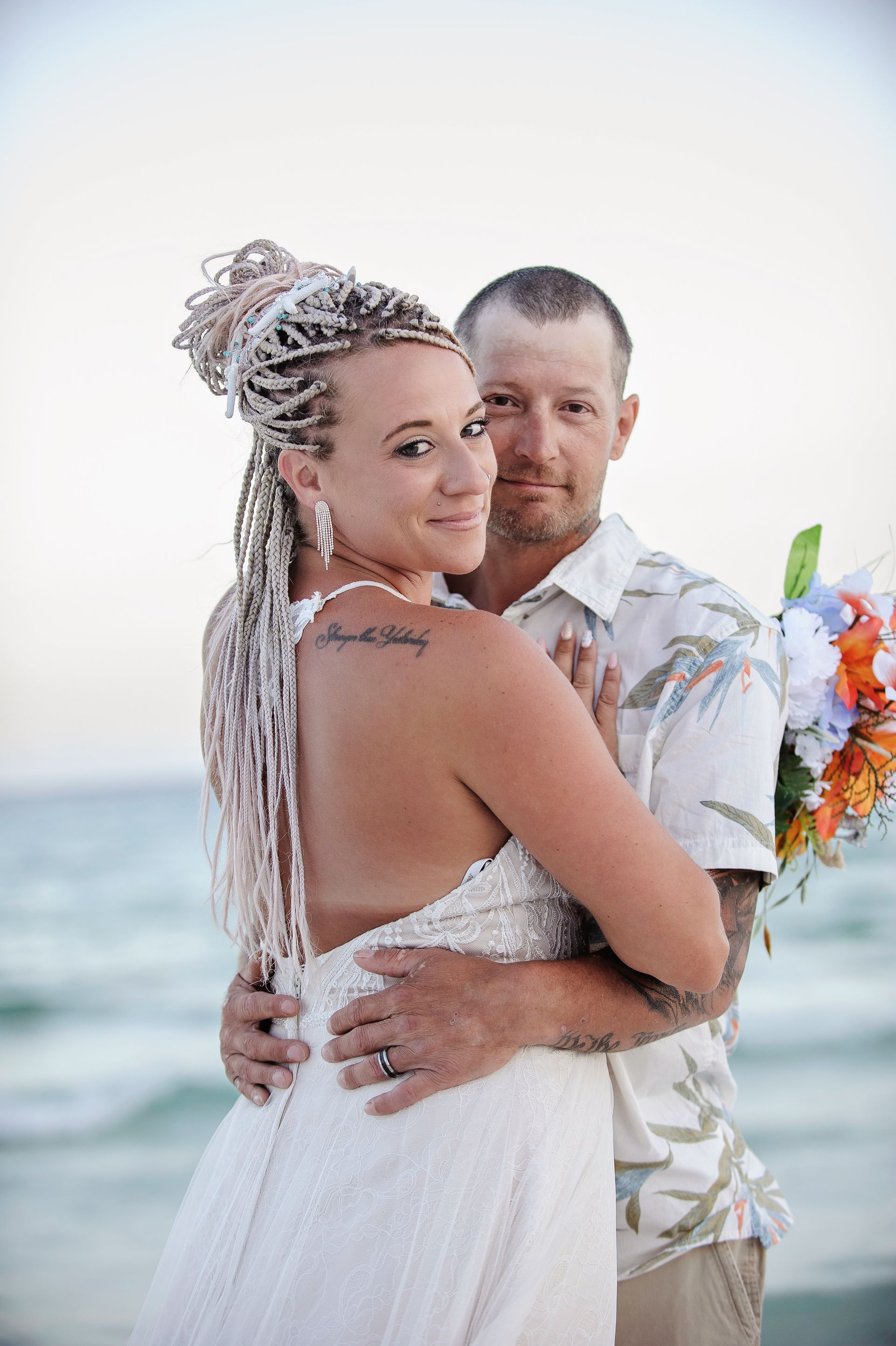 couple embracing during florida beach wedding