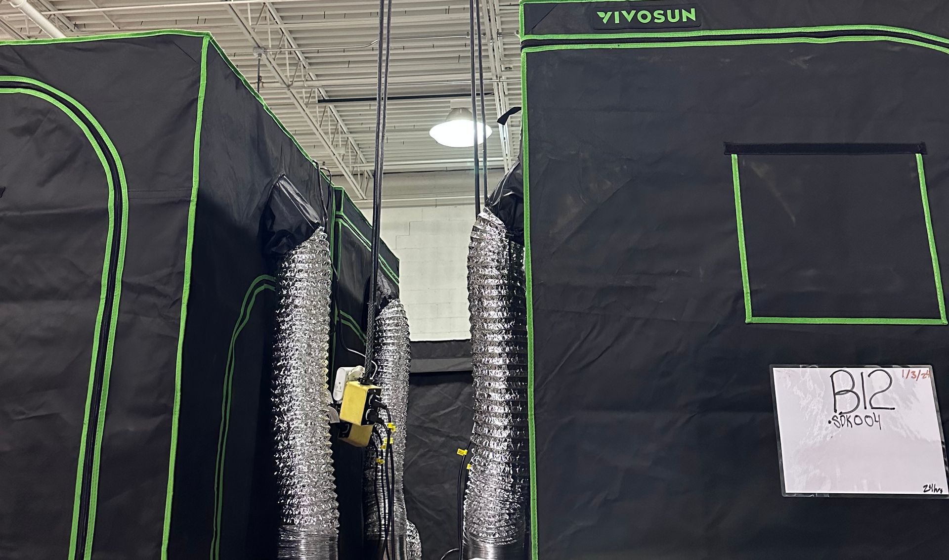 Indoor electrical around black padded walls, green outlines.