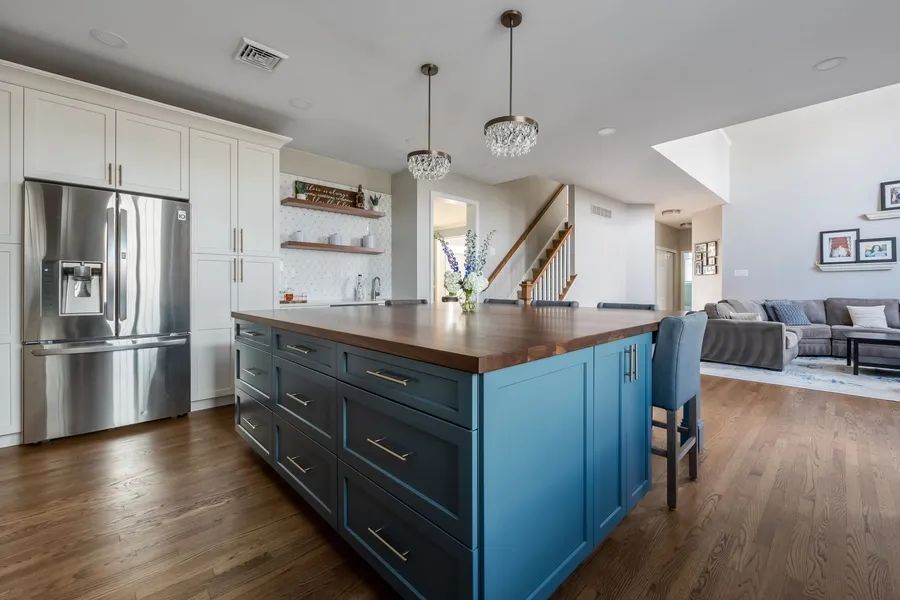 There is a large island in the middle of the kitchen.