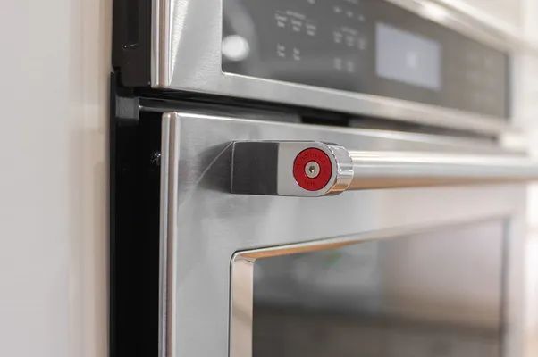 A close up of a stainless steel oven with the door open.