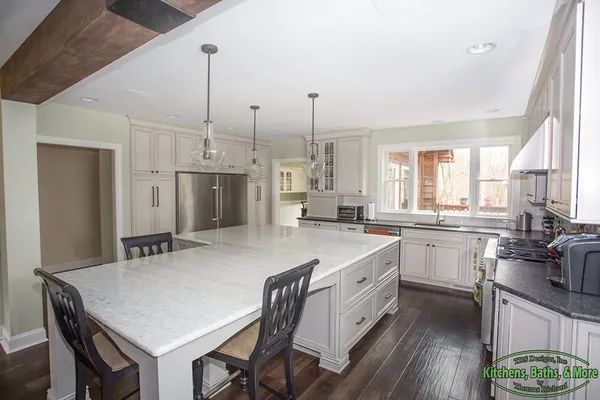 There is a large island in the middle of the kitchen.