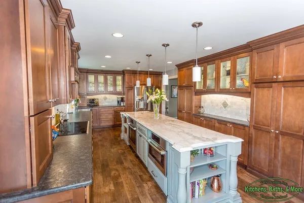 A kitchen with a large island in the middle of it.