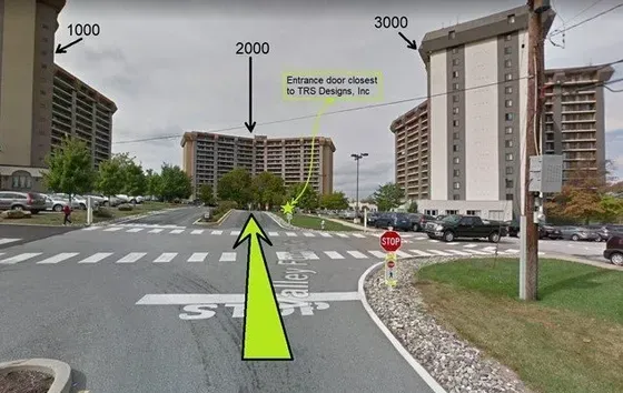 A yellow arrow points to a stop sign on the side of the road.