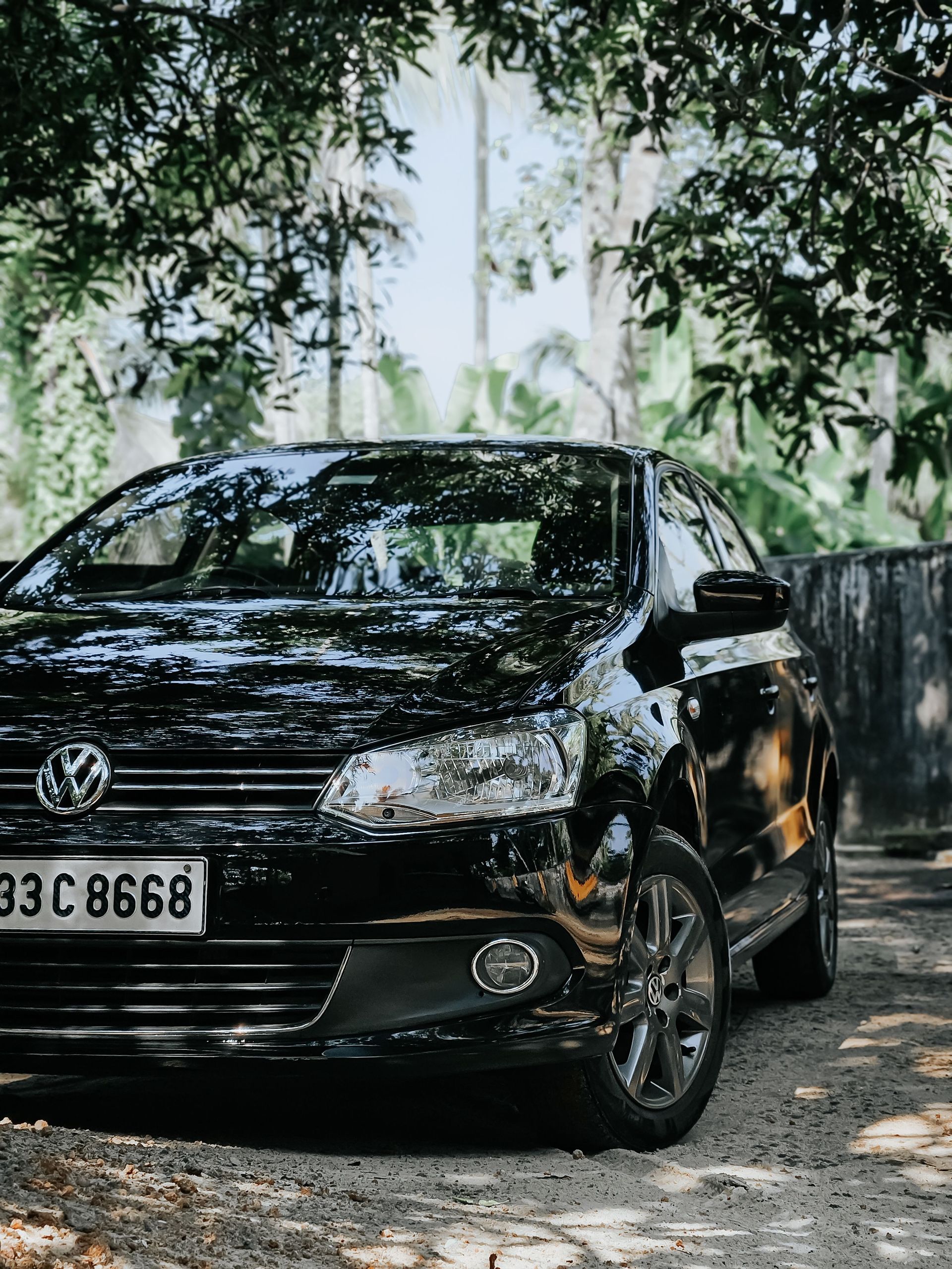 Black Volkswagen sedan — exterior detailing project by First Class Decals and Details Houston