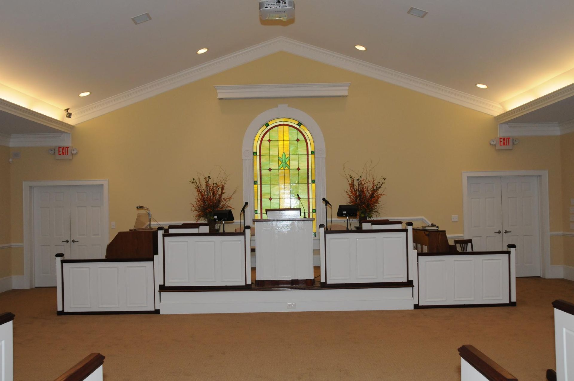 The inside of a church with a stained glass window