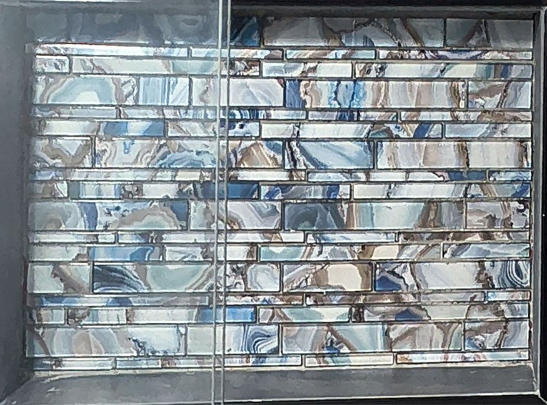 Closed metal window with a blue-and-white stained-glass pattern