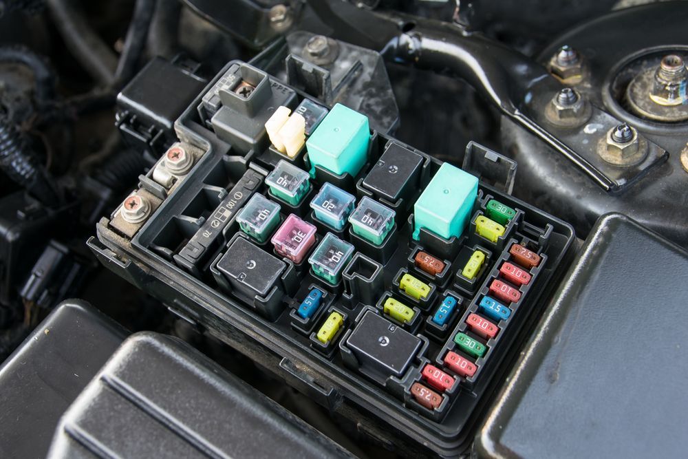 A Fuse Box Is Sitting Under The Hood Of A Car — Auto Spares Morisset In Morisset, NSW