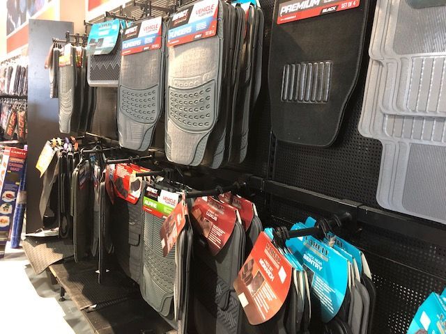 A Row Of Car Mats Hanging On A Rack In A Store — Auto Spares Morisset In Morisset, NSW