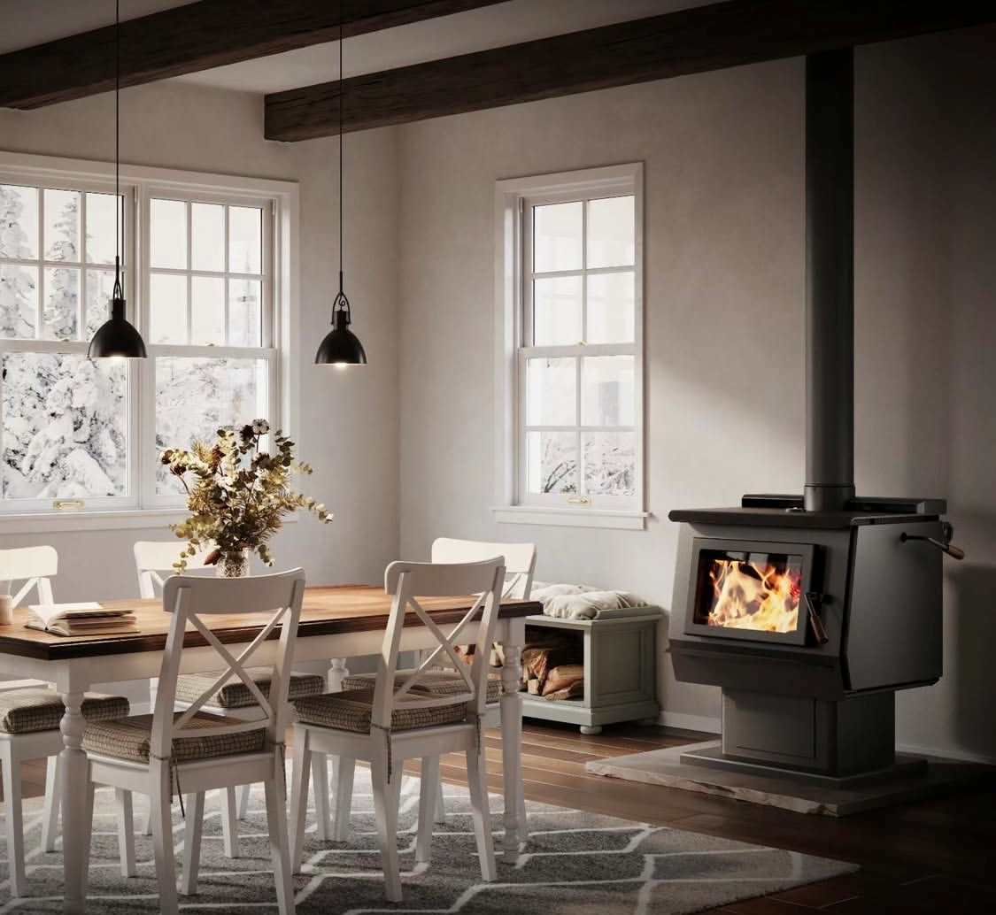 Red wood stove on brick hearth with black vent pipe, against a brick wall in a living room Red wood stove on brick hearth with black vent pipe, against a brick wall in a living room