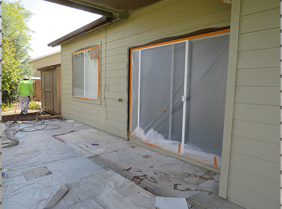 windows taped during house painting