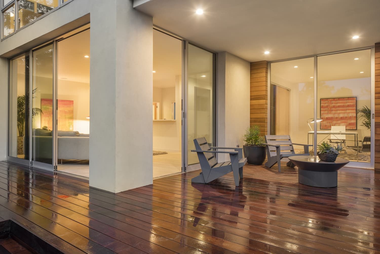 A Wooden Deck with Chairs and A Table in Front of A House — A Brush With Colour in Kawungan, QLD