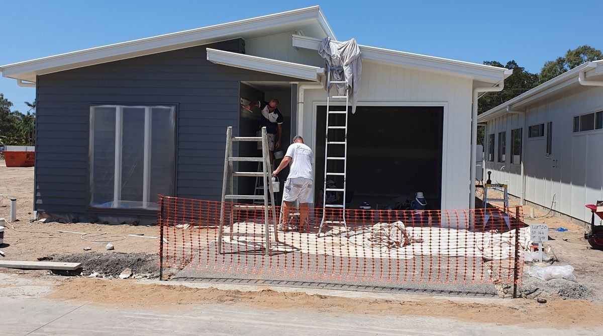 A Person Is Spraying Powder Paint on A Piece of Metal — A Brush With Colour in Urraween, QLD