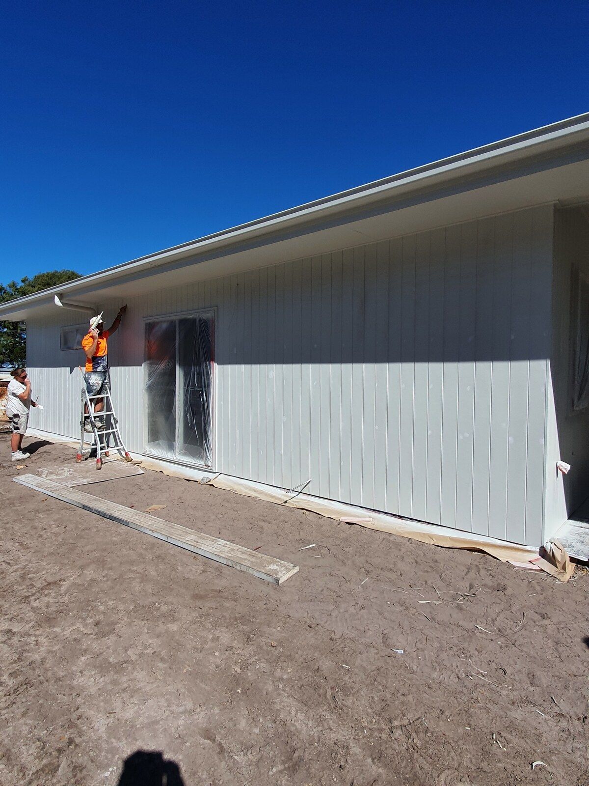 A Person Is Spraying Powder Paint on A Piece of Metal — A Brush With Colour in Craignish, QLD