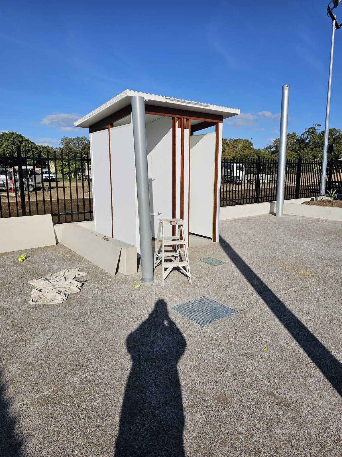 A Person Is Spraying Powder Paint on A Piece of Metal — A Brush With Colour in Eli Waters, QLD