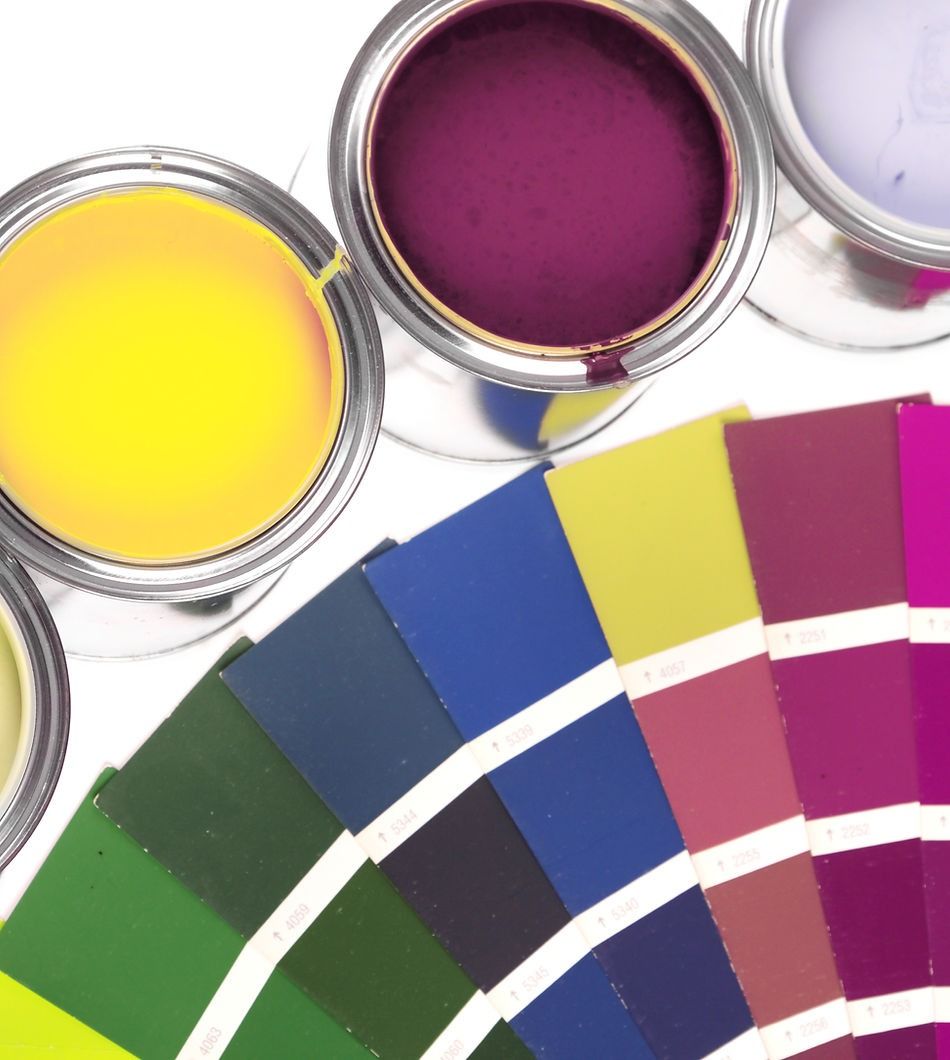 Several Cans of Paint Sit Next to A Palette of Colors — A Brush With Colour in Urraween, QLD