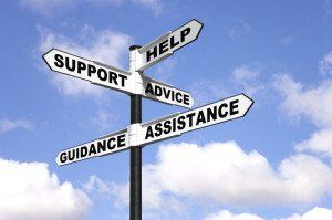 A sign that says support advice assistance and guidance on it.