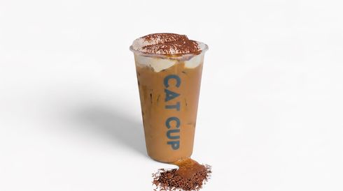 Tall iced drink in a clear cup with blue “CACTUS” text, topped with powder, spilling on a white background