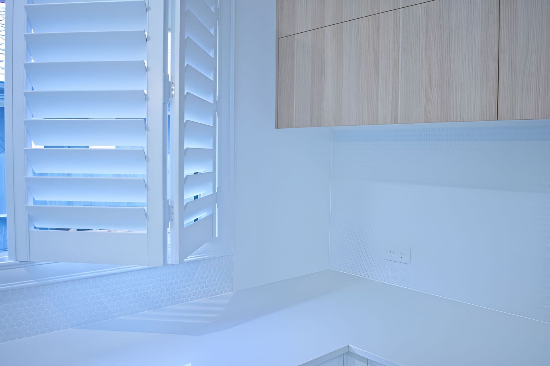A Bathroom With White Shutters on the Windows — Homestead Blinds in Wodonga, VIC