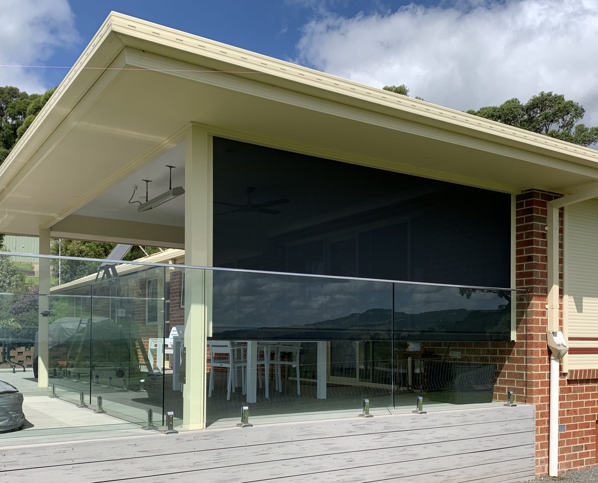 An outdoor blind on a house with brick walls โ Homestead Blinds in Wodonga, VIC