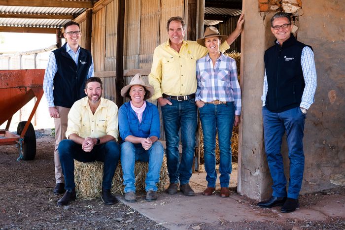 Schell Family farmers are standing with Rick Albertini, partner, and Bradley Barnes, partner, at their family farm.