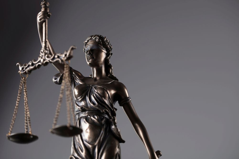 Statue of Lady Justice Holding Scales, Blindfolded — Hannaway Lawyers in Port Macquarie, NSW