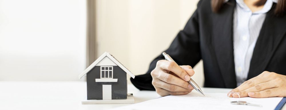 A Real Estate Transaction or Contract Signing — Hannaway Lawyers in Port Macquarie, NSW