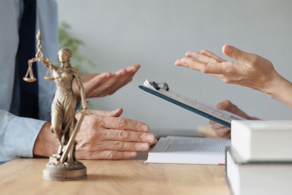 A Person Reviewing Legal Documents on a Desk — Hannaway Lawyers in Port Macquarie, NSW