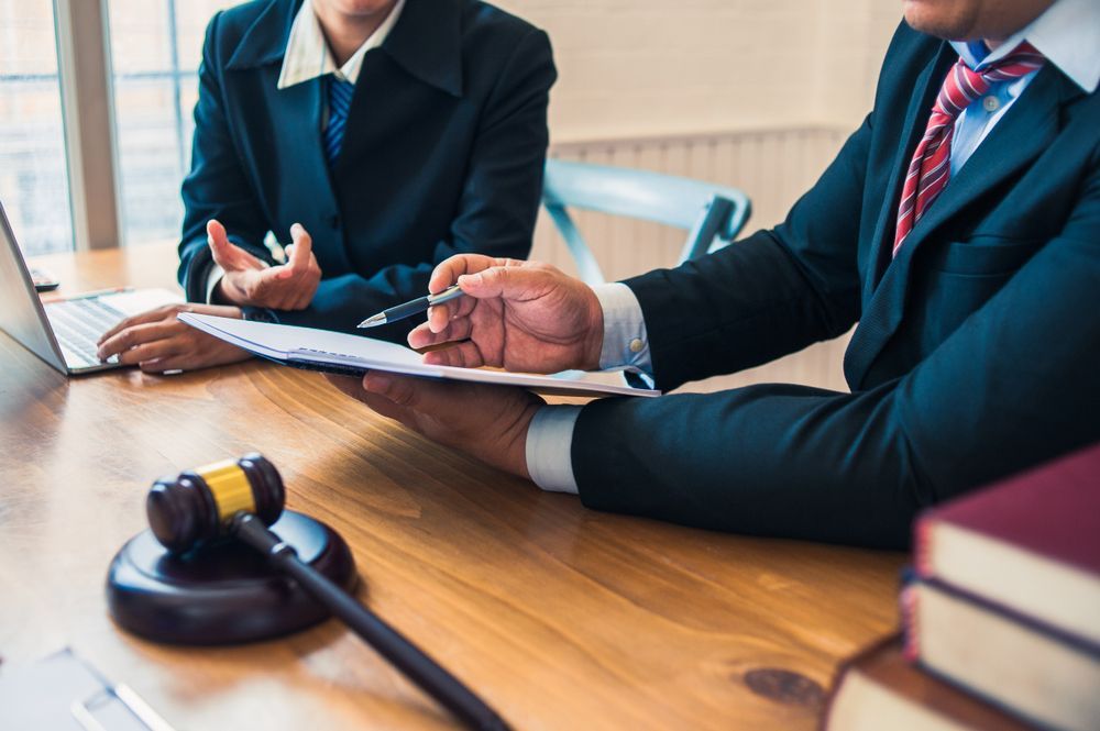 Two Attorneys Discussing Legal Documents