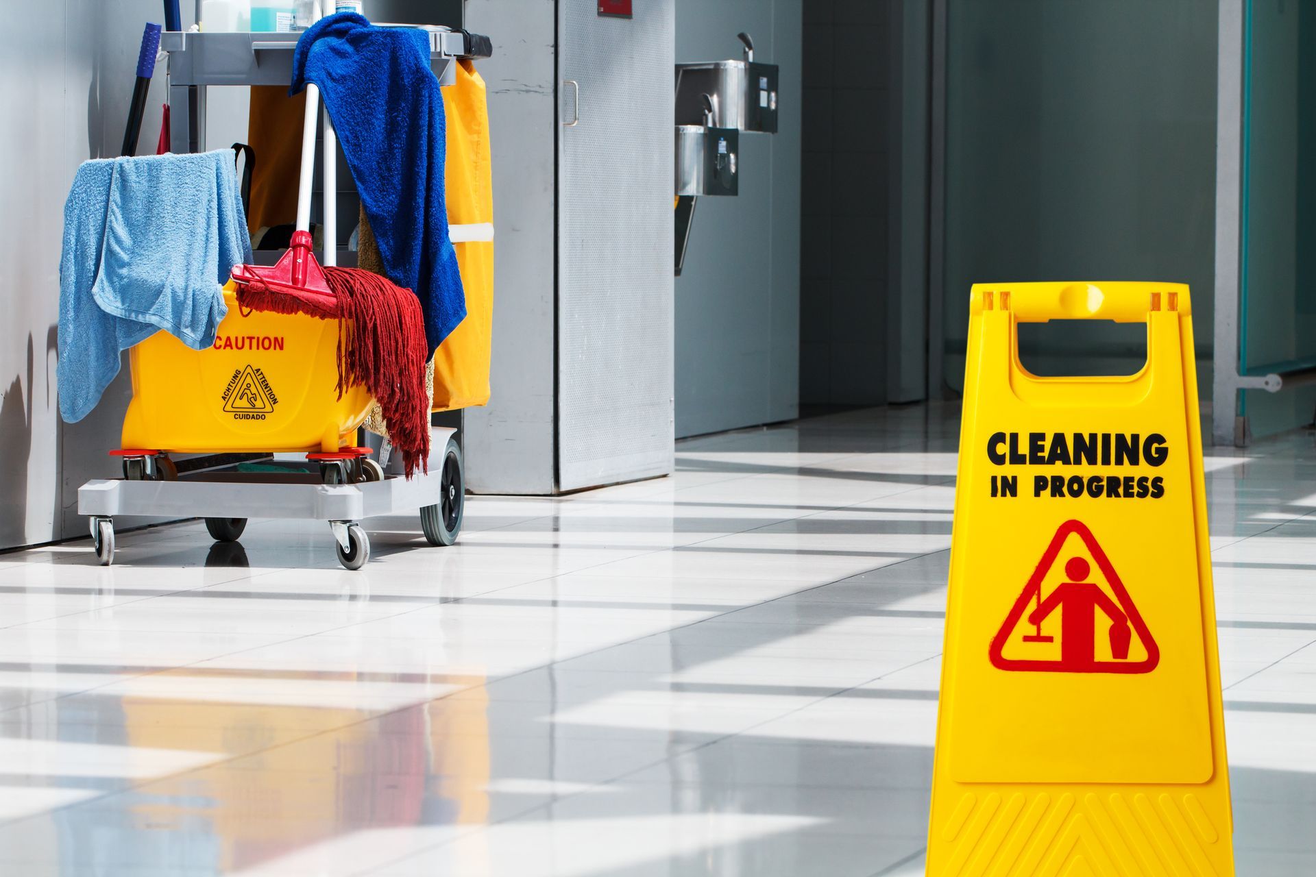 A yellow sign that says cleaning in progress on it
