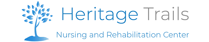 Logo for Heritage Trails Nursing and Rehabilitation Center, with a blue tree icon and text.
