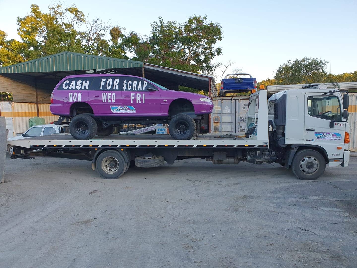 Tow Truck with Car — Local Vehicle Scrapping And Repair Professionals in Bondoola, QLD