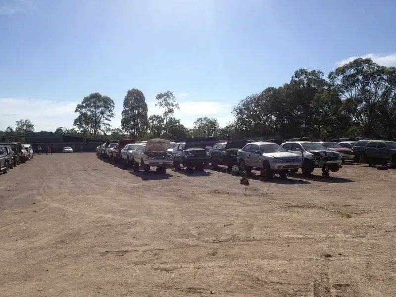 Row of Cars in Wreckers Yard — Local Vehicle Scrapping And Repair Professionals in Bondoola, QLD